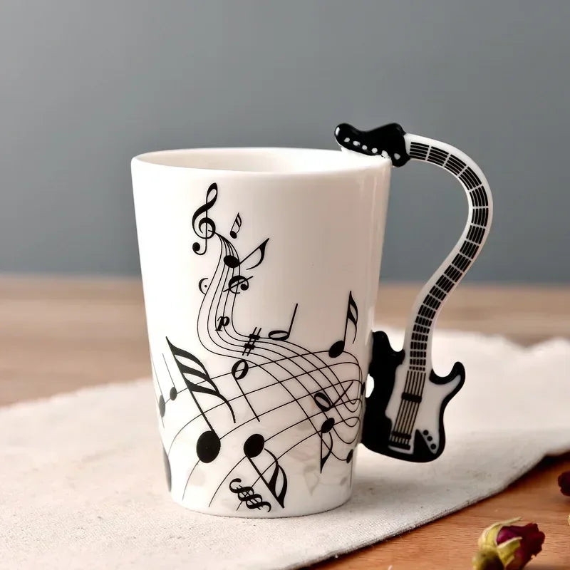 Taza de cerámica de 240 ml con asa en forma de instrumento musical, para café, té o leche, en diseños de guitarra, violín, piano o nota musical