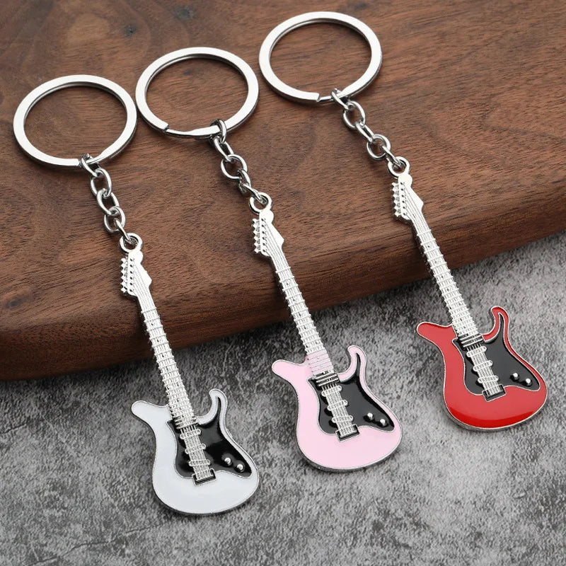 Llavero de guitarra eléctrica en aleación de zinc, souvenir para conciertos y festivales, en negro, blanco, rojo, rosa, azul o morado