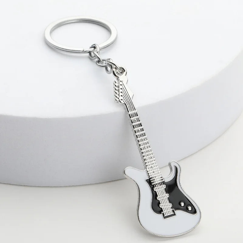 Llavero de guitarra eléctrica en aleación de zinc, souvenir para conciertos y festivales, en negro, blanco, rojo, rosa, azul o morado