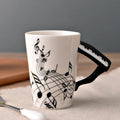 Taza de cerámica de 240 ml con asa en forma de instrumento musical, para café, té o leche, en diseños de guitarra, violín, piano o nota musical