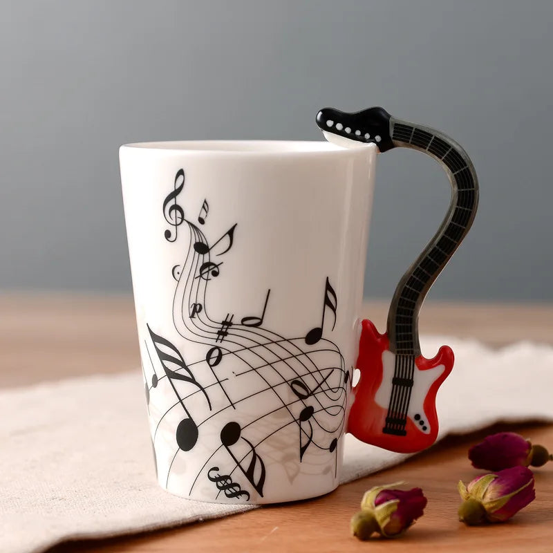 Taza de cerámica de 240 ml con asa en forma de instrumento musical, para café, té o leche, en diseños de guitarra, violín, piano o nota musical